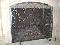 Hand forged fireplace screens by blacksmiths at Ponderosa Forge