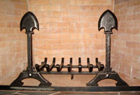 Hand forged fireplace andirons by blacksmiths at Ponderosa Forge