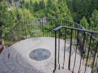 balcony deck railing with compass covered fire pit
