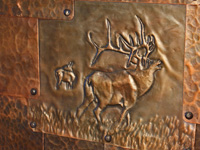 copper elk repousse in copper patchwork door