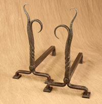 Hand forged fireplace andirons by blacksmiths at Ponderosa Forge