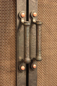 Hand forged fireplace door handle option by blacksmiths at Ponderosa Forge