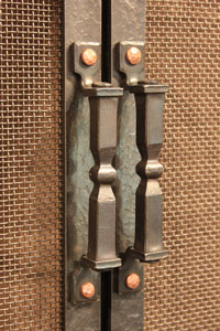 Hand forged fireplace door handle option by blacksmiths at Ponderosa Forge
