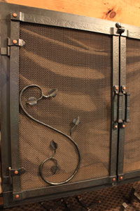 Hand forged fireplace door hinge option by blacksmiths at Ponderosa Forge