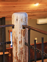 corner wood post connection to bronze top rail